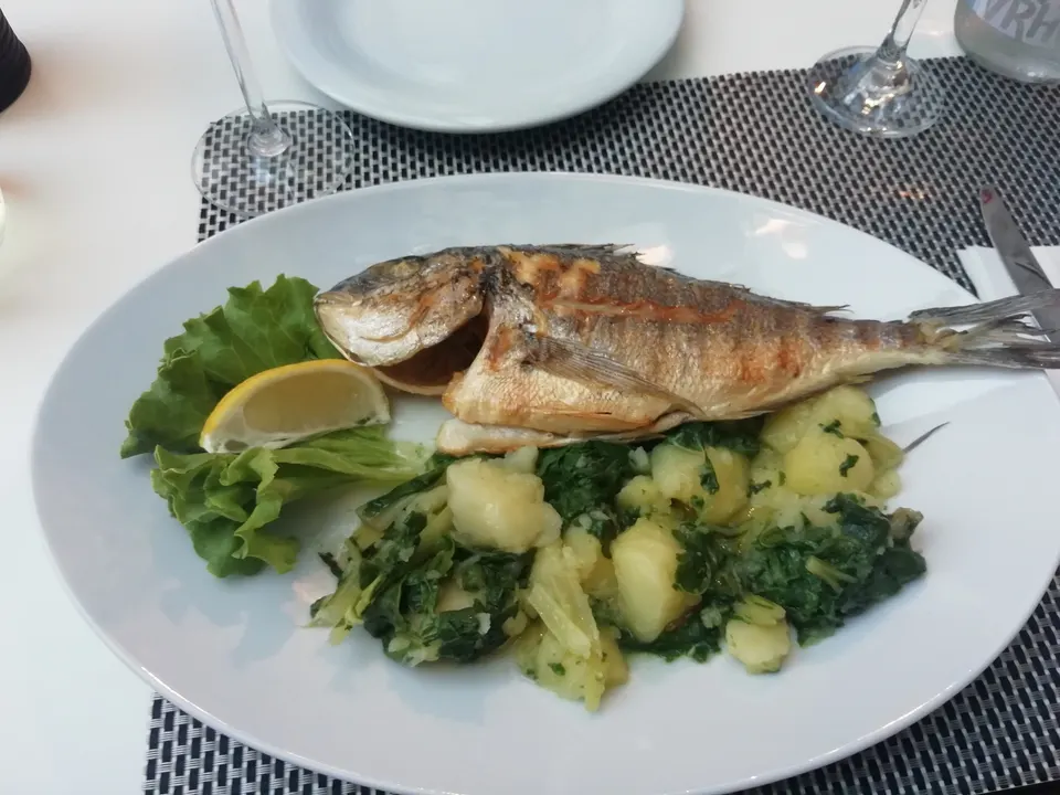 Grilled fish with lemon and the classic side of chard and potatoes.