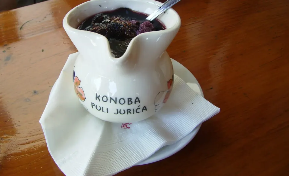 Supa in a bukaleta: warm red wine with toasted bread, served in an Istrian konoba.