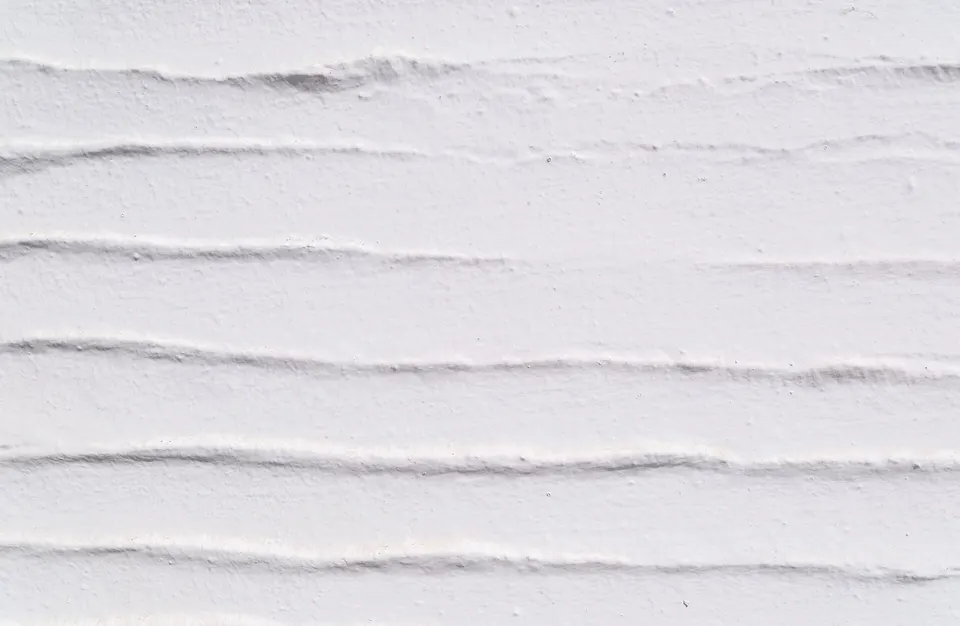 A hand-applied lime-plastered wall on the Greek island of Tinos: soft, uneven and porous.