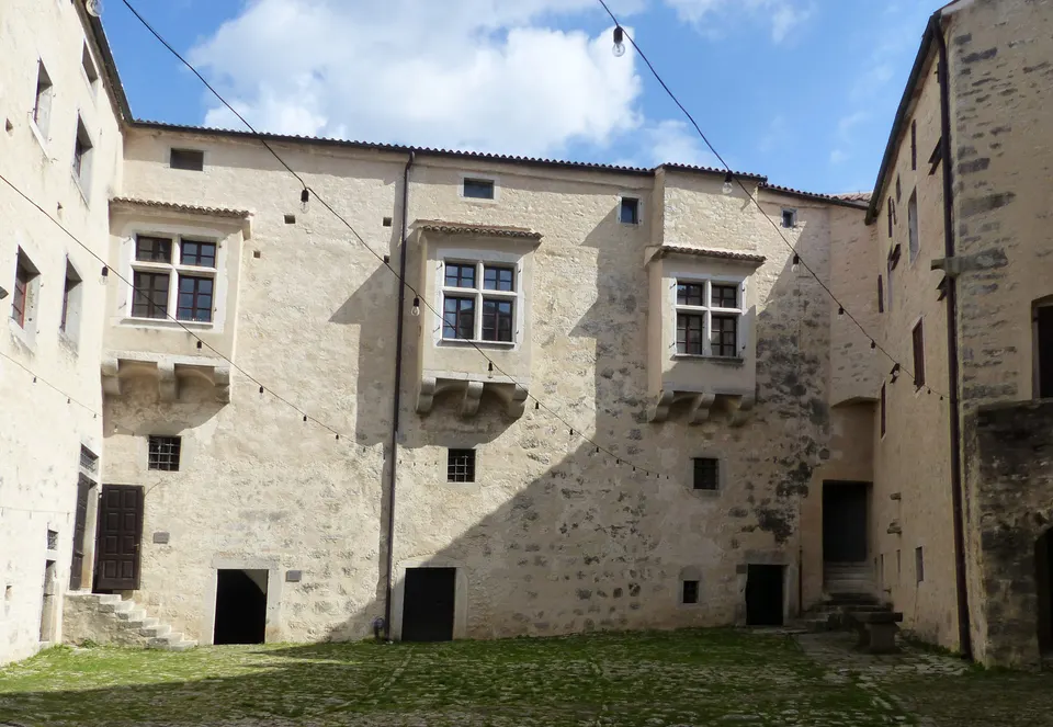 The inner courtyard of Pazin castle, with its stone windows and balconies.