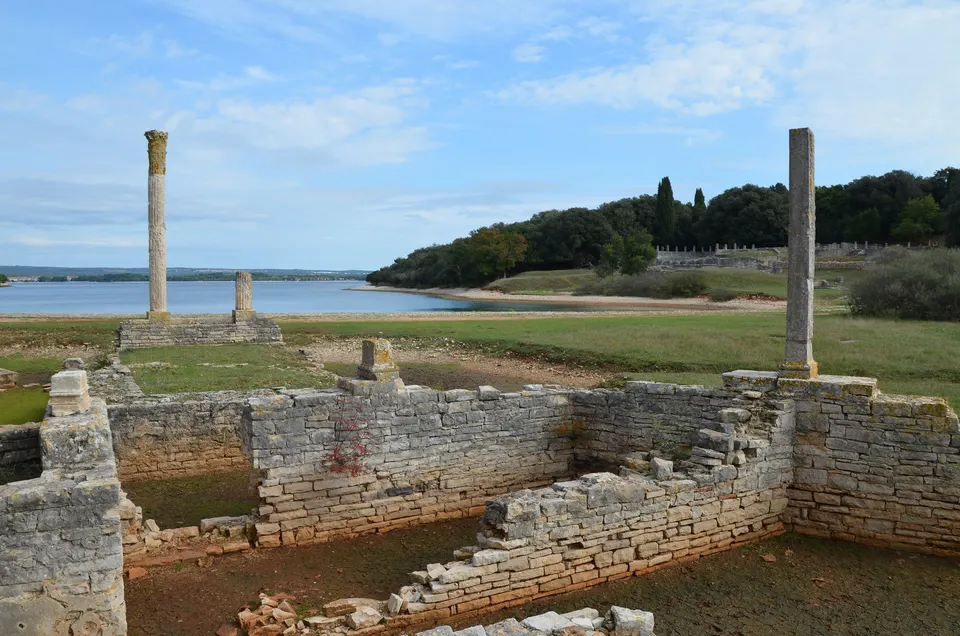 The remains of the Roman villa in Verige Bay on Brijuni, with columns standing above the low walls.