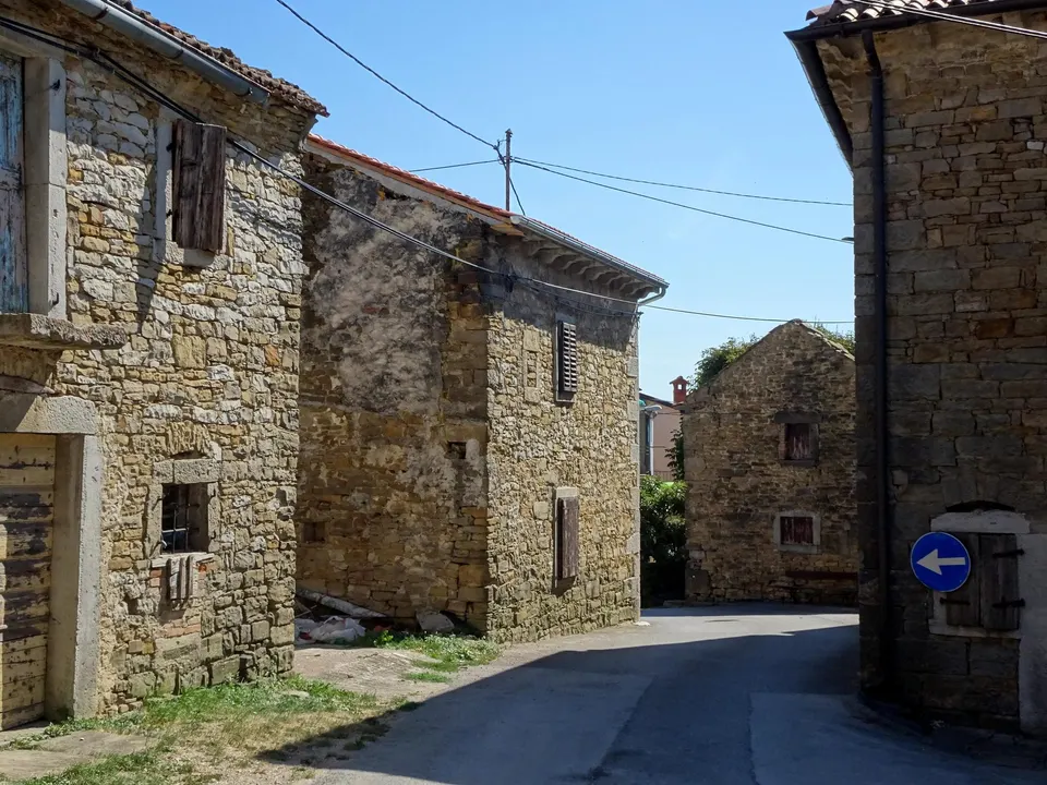 Stone houses on a village street in Vrh, inland Istria.